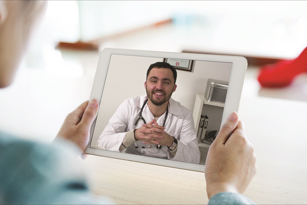 Virtual primary care doctor performing a virtual evaluation on iPad