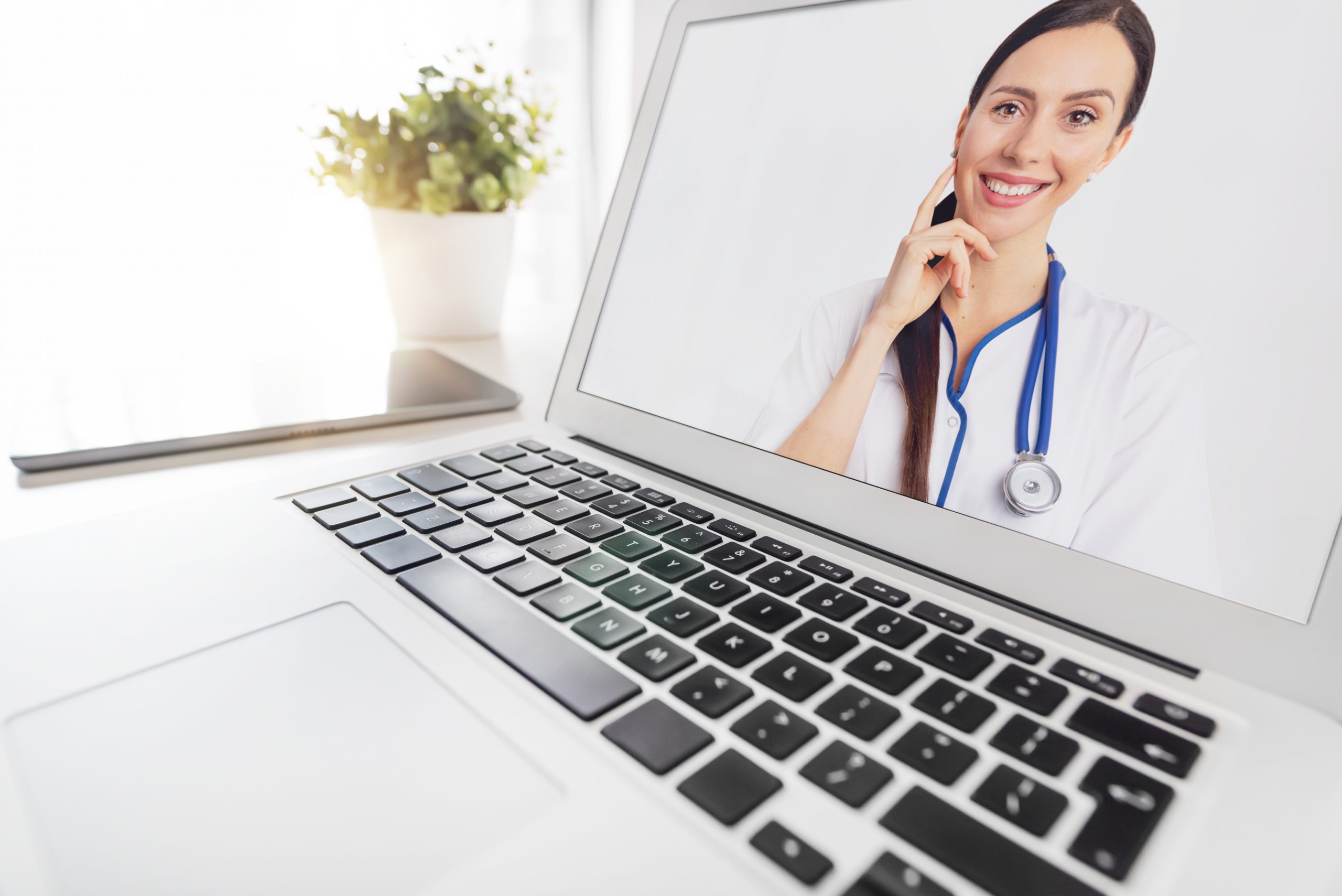 Telemedicine doctor provides virtual mental health services on laptop